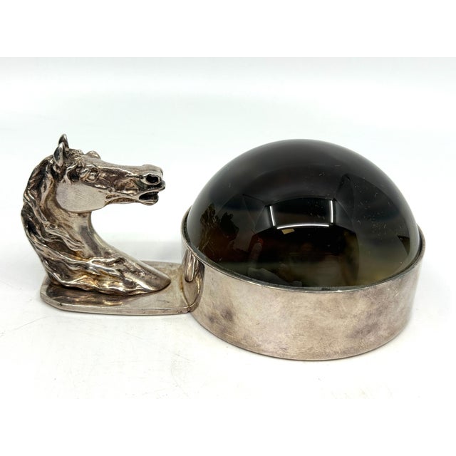 A wonderful vintage Hermes Silverplated Horse motif magnifying paperweight. The detail of the casting is quite...
