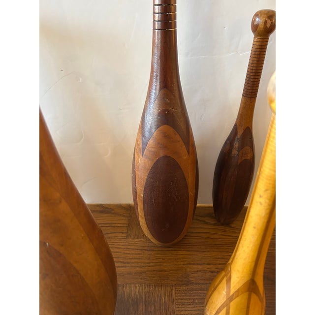 A rare collection of antique inlaid exercise clubs of various sizes from 22.5” tall to 15.5 “ high. 5” to 3” diameter A...