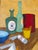A charming and colorful 1972 still life by artist E.J. Troy, this Impressionist oil-on-board painting captures a warm...