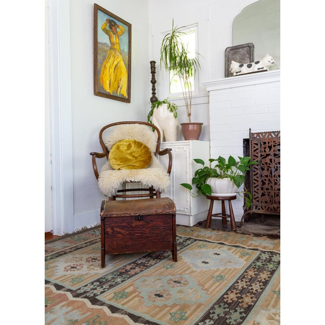 This rustic 19th-century shoe shine footstool features a dark mahogany-stained cedar or redwood with its original waxed...