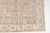 This is a vintage Turkish Oushak rug from the Mid 20th Century. The piece was hand-knotted.