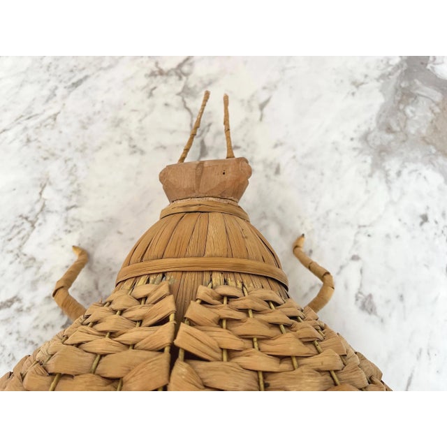 Huge whimsical wicker beetle hand crafted of natural reeds and carved wood woven around a metal frame with lifelike...