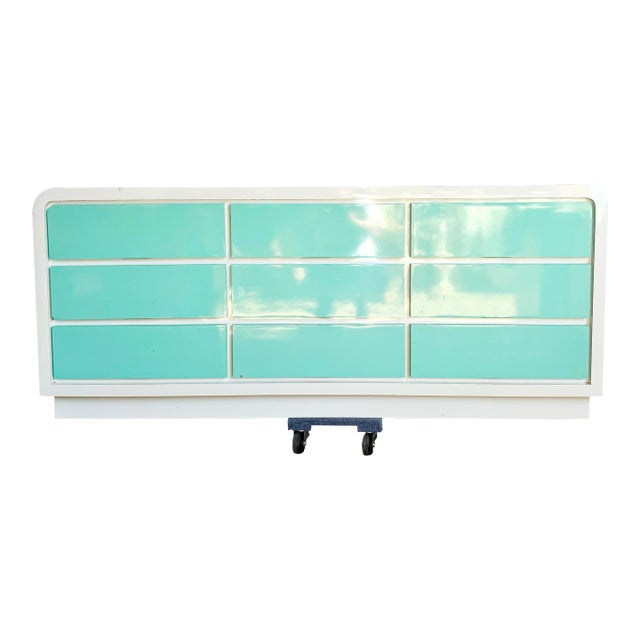 This striking postmodern dresser brings a refreshing burst of color and sculptural design to any contemporary interior....