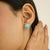 These elegant stud earrings feature two natural turquoise cabochons totaling 4.38 carats, set in rich 14k yellow gold....