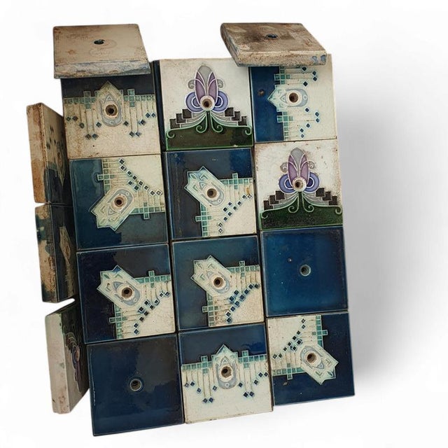 53 x Art Nouveau tiles / oven tiles with attach holes 1920s 53 x Art Nouveau tiles / oven tiles with attach holes 1920s...
