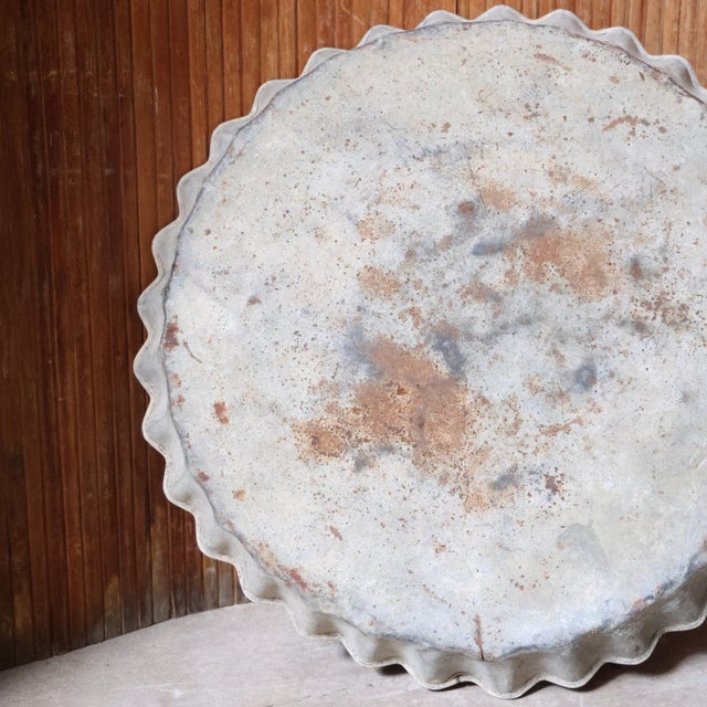 20th-century French tin tray featuring a scalloped edge and gently aged finish. Both functional and decorative, its...