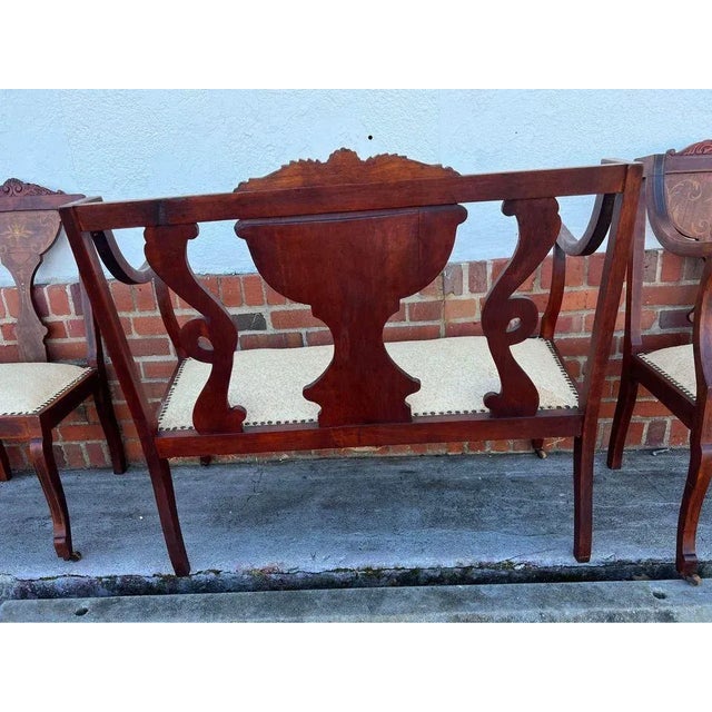 Edwardian marquetry inlaid mahogany settee satinwood inlays. Well made, sturdy. Approximate measurements: Height 37” width...