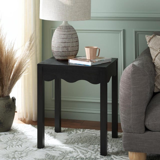 Introduce a touch of sophistication with the Lilith Square Wave Accent Table in a calming matt black color. This table...