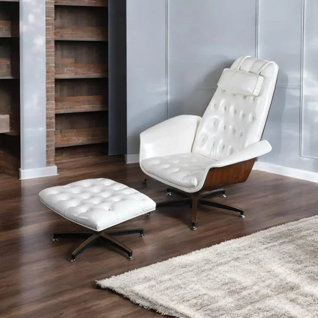 This listing is for ONE chair with ottoman. The second chair has been sold. Beautifully restored Mid-Century Modern white...