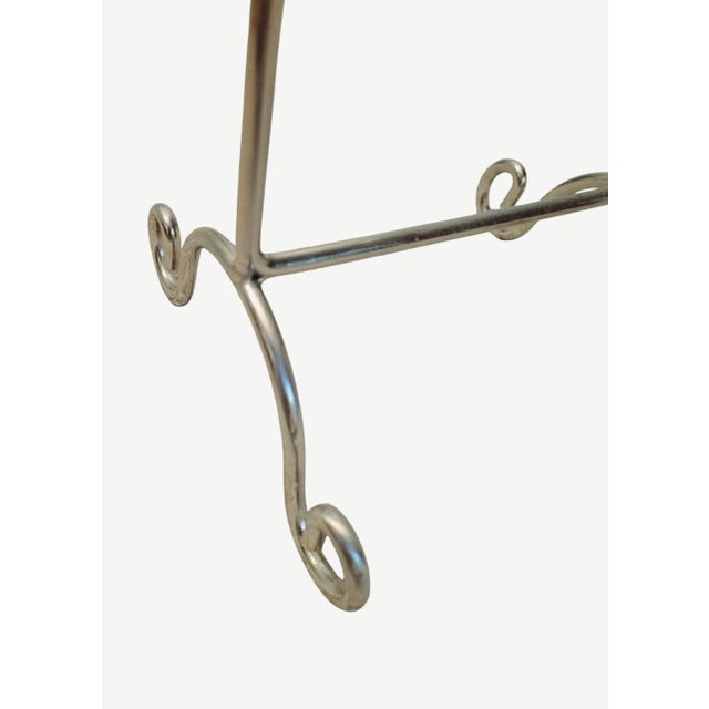 An elegant polished nickel scroll vanity top freestanding wash cloth towel rack stand. The stand is so pretty with curvy...