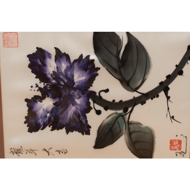 An original framed watercolor by Chinese artist Zhang Li (who is known in the art world as Lily Taylor) depicting a deep...