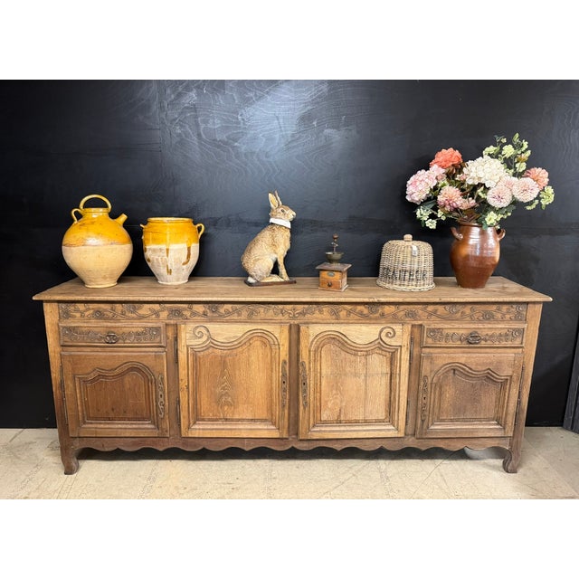 A lovely example of a French Oak Enfilade or Sideboard. Dating to the mid 19th Century. Having 4 doors and 2 drawers and...