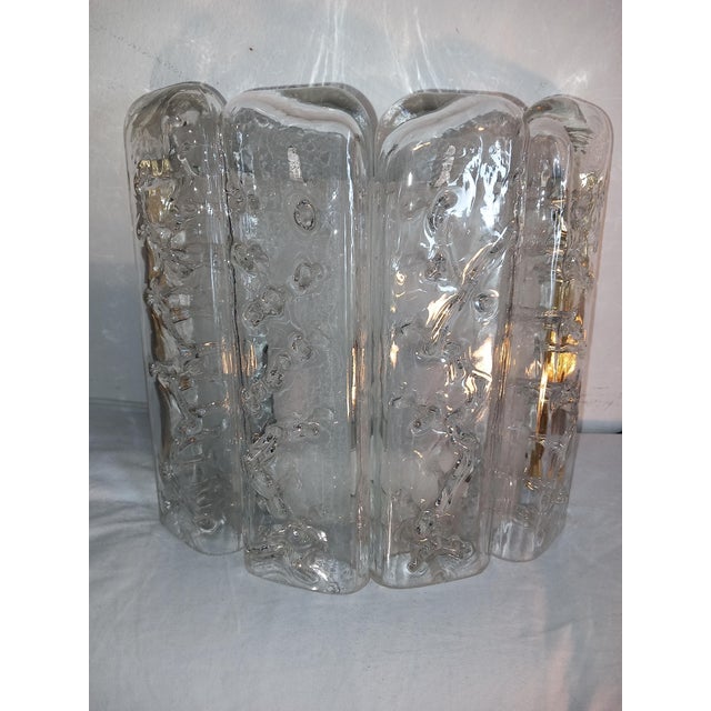 This wall lamp is a vintage model from Doria Lighting, dating from the 1960s or 1970s. Materials: It consists of a brass...