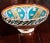 An under-glazed painted pottery bowl with abstract naive design, blue, ochre, brown. Moroccan antique pottery bowl of deep...