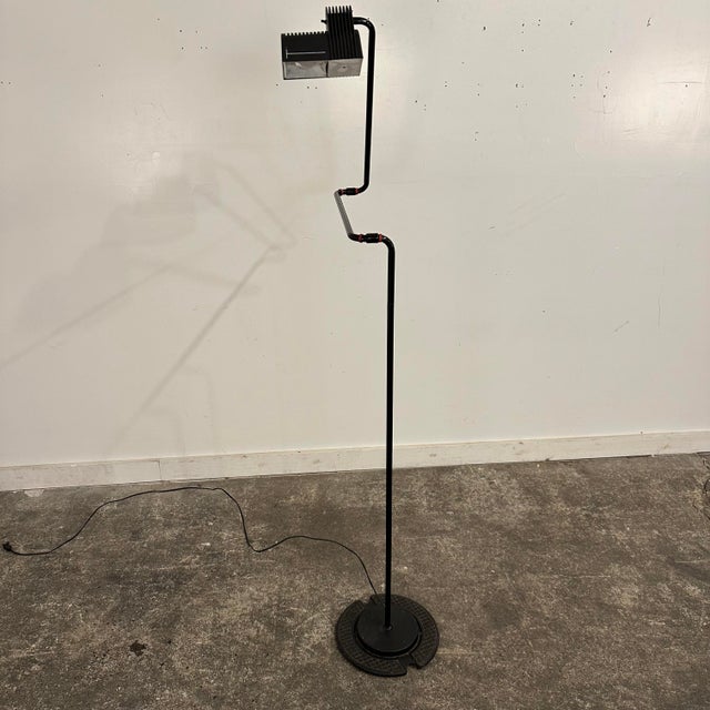 This bendable and extendable black floor lamp by Hannes Wettstein for Belux is a perfect example of 1980s postmodern...