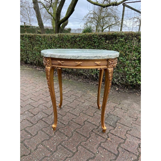 A refined mid-19th-century French Louis XVI–style side table, dating to circa 1860 and crafted in solid beechwood with its...