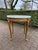 A refined mid-19th-century French Louis XVI–style side table, dating to circa 1860 and crafted in solid beechwood with its...