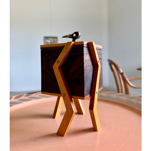 A studio craft, handmade box. The main box is created in a clean cube of figured American walnut. The lid and angular...