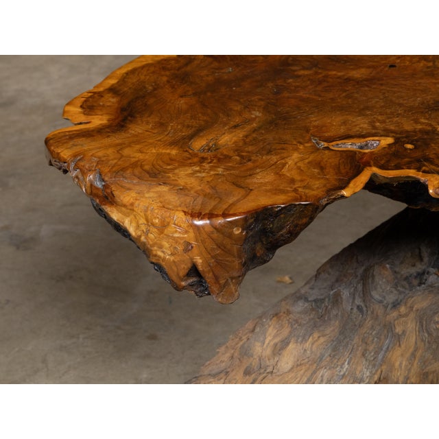 This exquisite vintage American live edge redwood coffee table exudes a rustic charm and natural elegance that...
