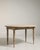 A versatile drop-leaf table reflecting 19th century domestic practicality, designed to expand or collapse depending on...