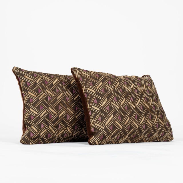 Pair of custom lumbar cushions from vintage African Kuba cloth. Hand-dyed raphia palm handwoven in a checkered pattern....