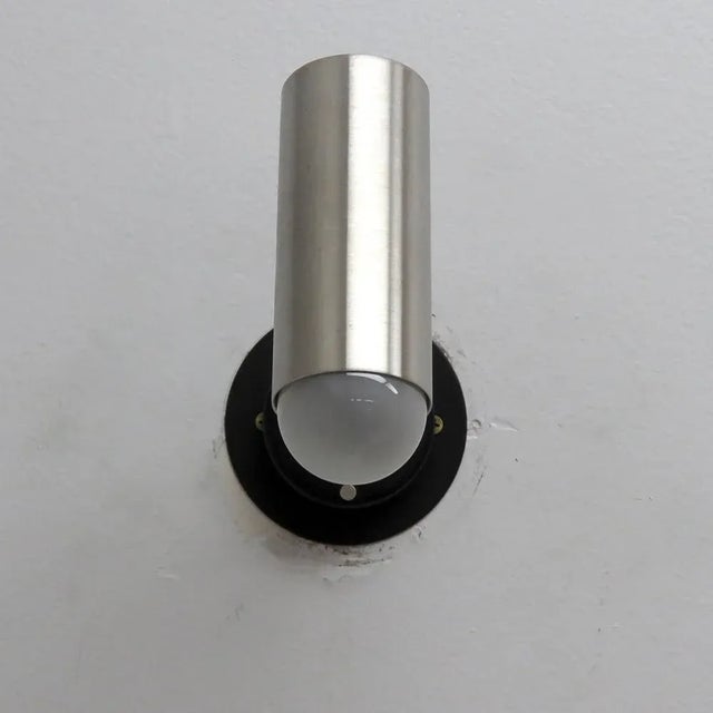 Pair of elegant articulate wall lights by Jean Boris Lacroix, France in brushed aluminum and enameled metal, swivel joint...