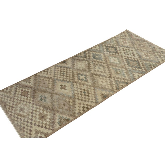 From a bold Turkish designer, a 4x10 vintage rug of the 1960s—now joining our Mid-Century Pasha collection. The shabby-...