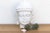 Carved from a single, heavy block of solid white marble. This piece captures the classic iconography of the Buddha in a...