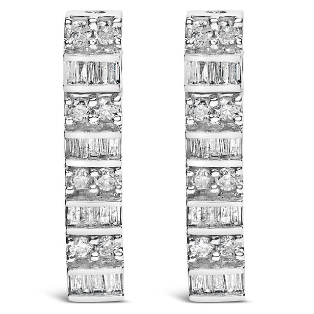 Experience the sheer elegance and timeless charm of these exquisite drop earrings, masterfully crafted from rhodium-plated...