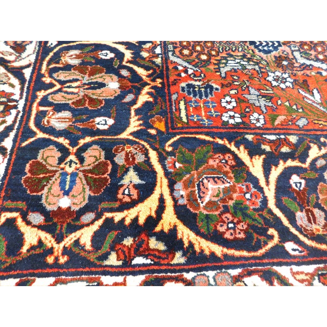 Featuring a distinctive central panel with birds and floral motifs, birds of paradise, surrounded by a broad navy -blue...