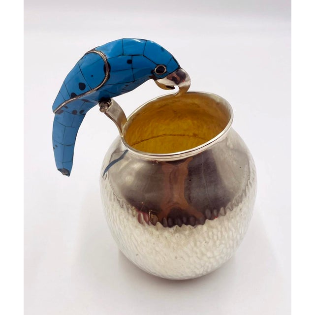 A charming and collectible vintage silver-plated water pitcher designed and handcrafted in Taxco, Mexico by the highly...