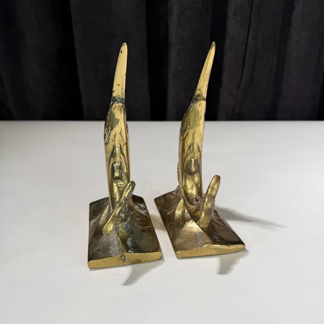 A well-made and thoughtfully designed pair of vintage swordfish bookends, cast in solid metal with a brass finish. Each...