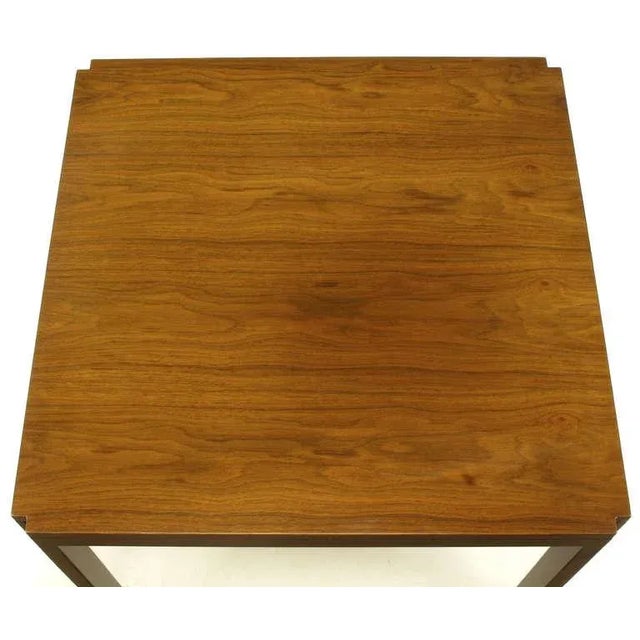 Edward Wormley figured walnut Parsons style side table with unusual aluminum inlaid legs. Incised corners start at the top...