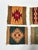 A vibrant set of four vintage Southwestern-style wool textile coasters featuring geometric motifs and handwoven character....