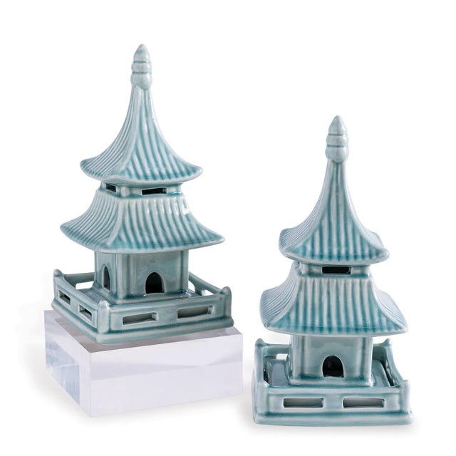 Classic Asian styled porcelain pagodas are shown with a celadon glaze. Object can also double as bookends. Coordinates...