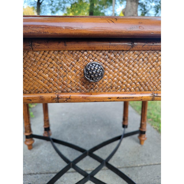 The Samba Game Table for Tommy Bahama's Island Estate collection features a warm maple top and inset cracked coco shell...
