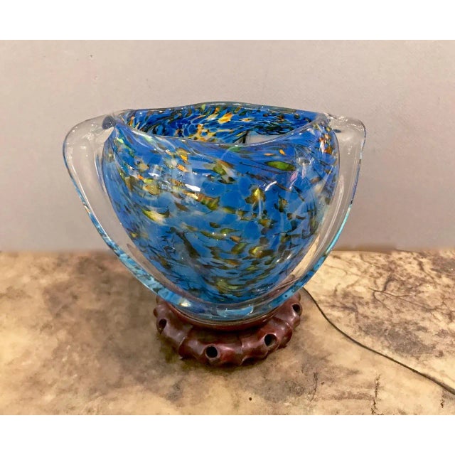 This is a unique Murano swirled multi-colored glass body with applied clear glass. The intrinsic energy of the glass is a...