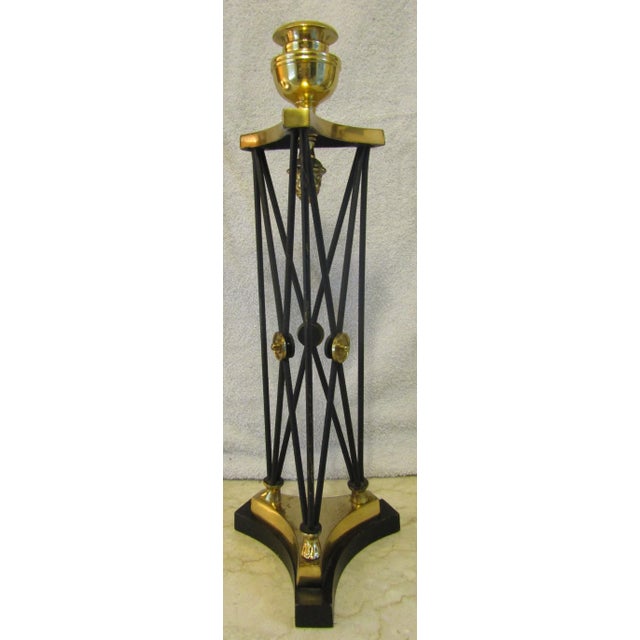 Empire Style Candlestick with Hoof Feet and Acorn Adornment Measures 6 1/2" wide and 18" tall. Brass and iron.