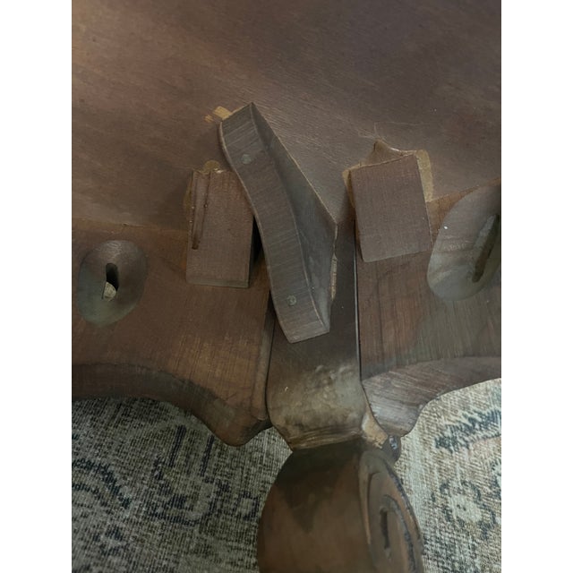 A beautifully executed Louis XV revival occasional table in carved and veneered walnut, early 20th century. The oval top...