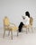 This piece presents as a pair of side chairs, distinguished by cream/pale yellow upholstery, white painted frame....