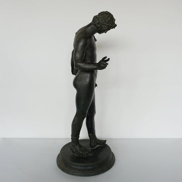 A large 'grand tour' late 19th century patinated bronze sculpture of the ancient roman hunter narcissus by michele amodio....