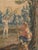 A handwoven Brussels tapestry of dancing peasants in a field with a boy playing jump rope and another with a bow and...