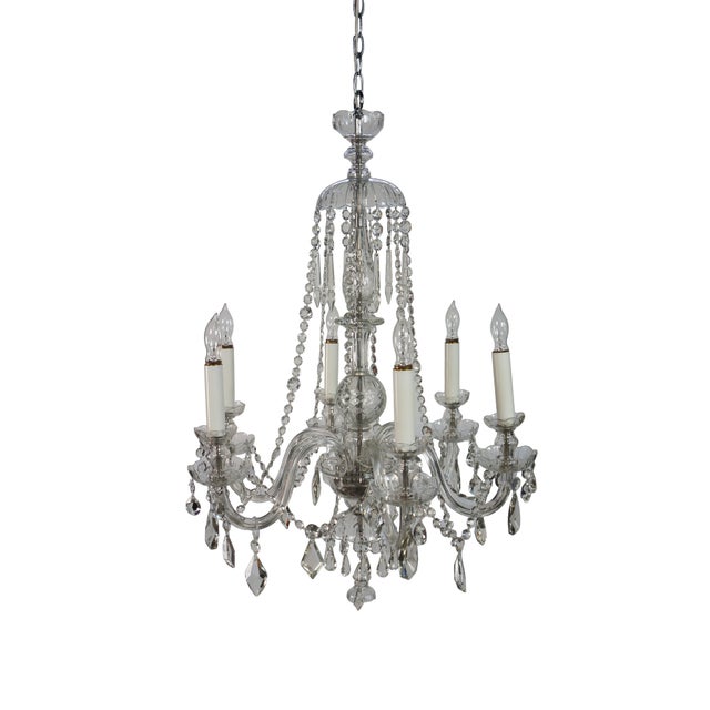 Vintage bohemian crystal six arm candlestick chandelier featuring a central glass column with hurricane shaped spheres /...