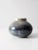 This is a vintage studio pottery vase. Signed by the artist, the bulbous handmade vase features a stunning blue and olive...