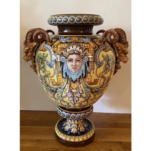 A monumental hand painted Majolica jardinière . The piece is wonderfully painted witha Maiden on one side and a Satyr on...