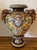 A monumental hand painted Majolica jardinière . The piece is wonderfully painted witha Maiden on one side and a Satyr on...