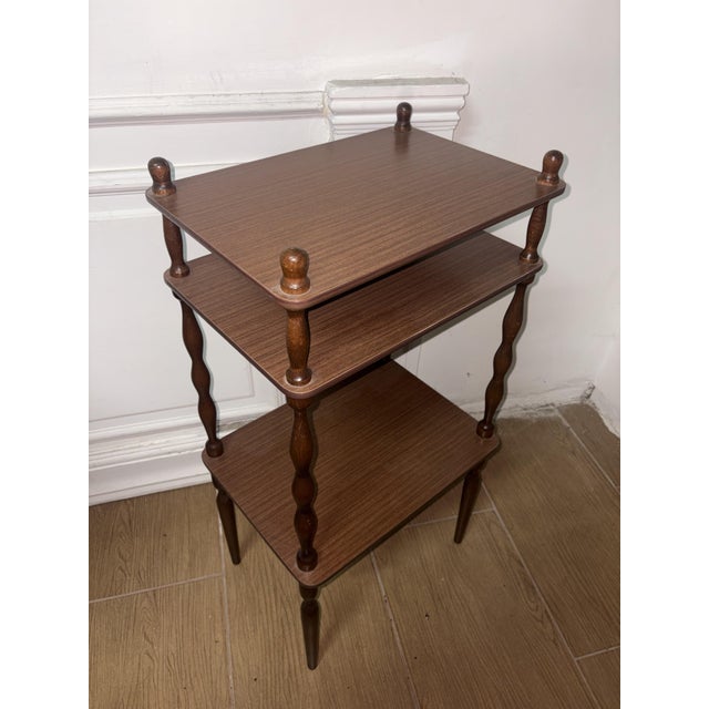 three-tier etagère features a wooden structure with elegant turned legs and decorative upper knobs height 85 cm, depth 30...