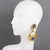 These Ultra-chic dangling clip-on earrings have a design reminiscent of Mercedes Robirosa's work. The earrings are a...