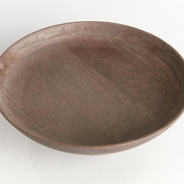 Contemporary and uniquely designed, this footed bowl is made of mango wood. Makes a beautiful serving bowl for dry foods,...