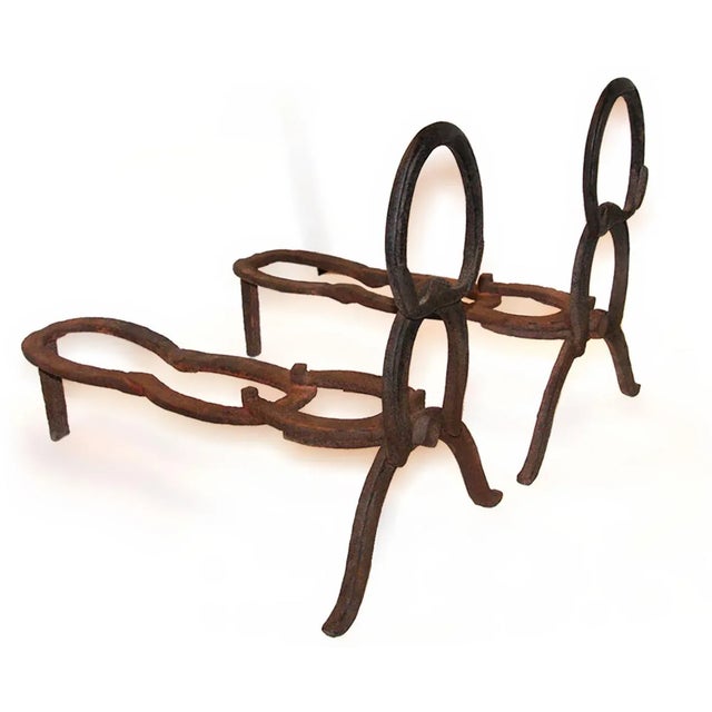 Early 20th century folk art andirons. Constructed from horseshoes.